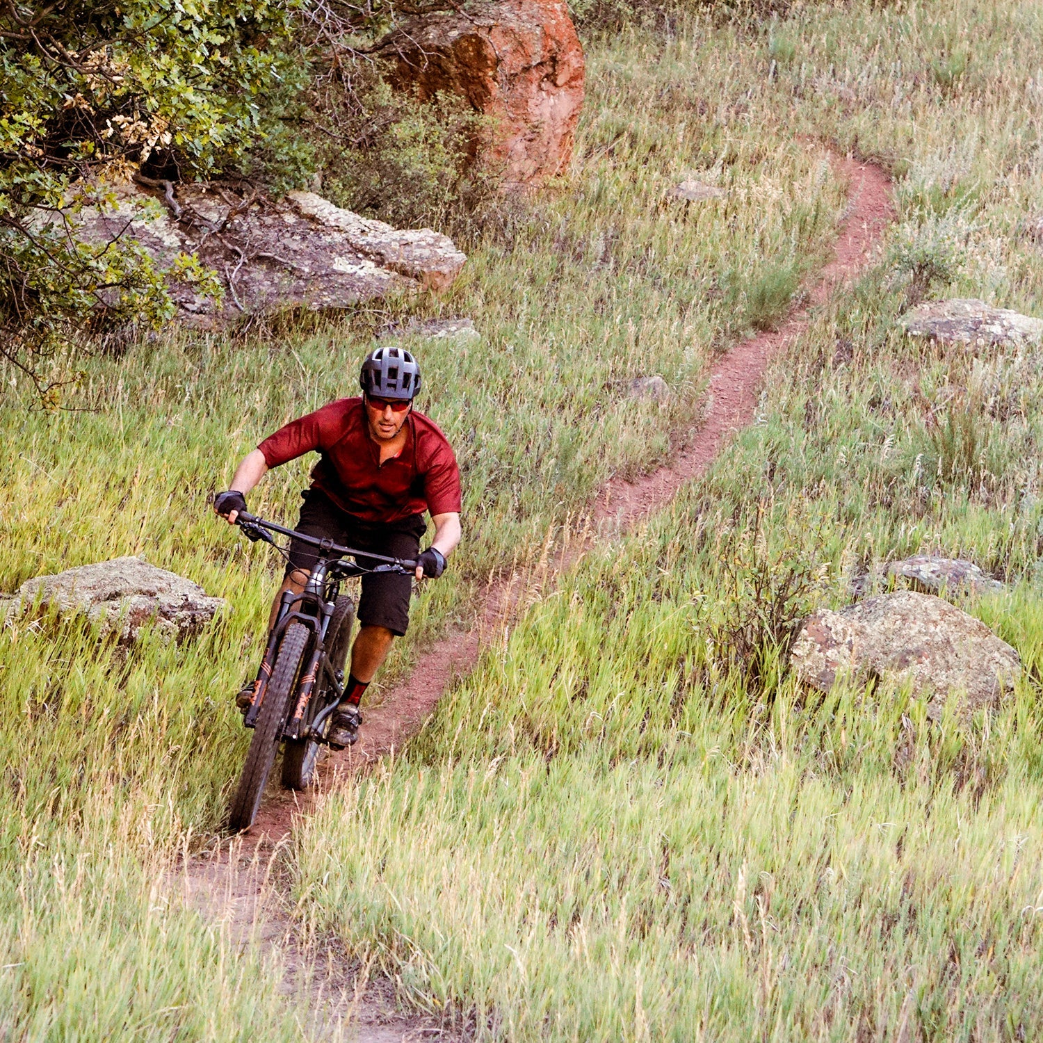 Mountain biker in a grass field
